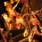 Big Band saxophone section. A candid view along the saxophone section of a big band in concert.