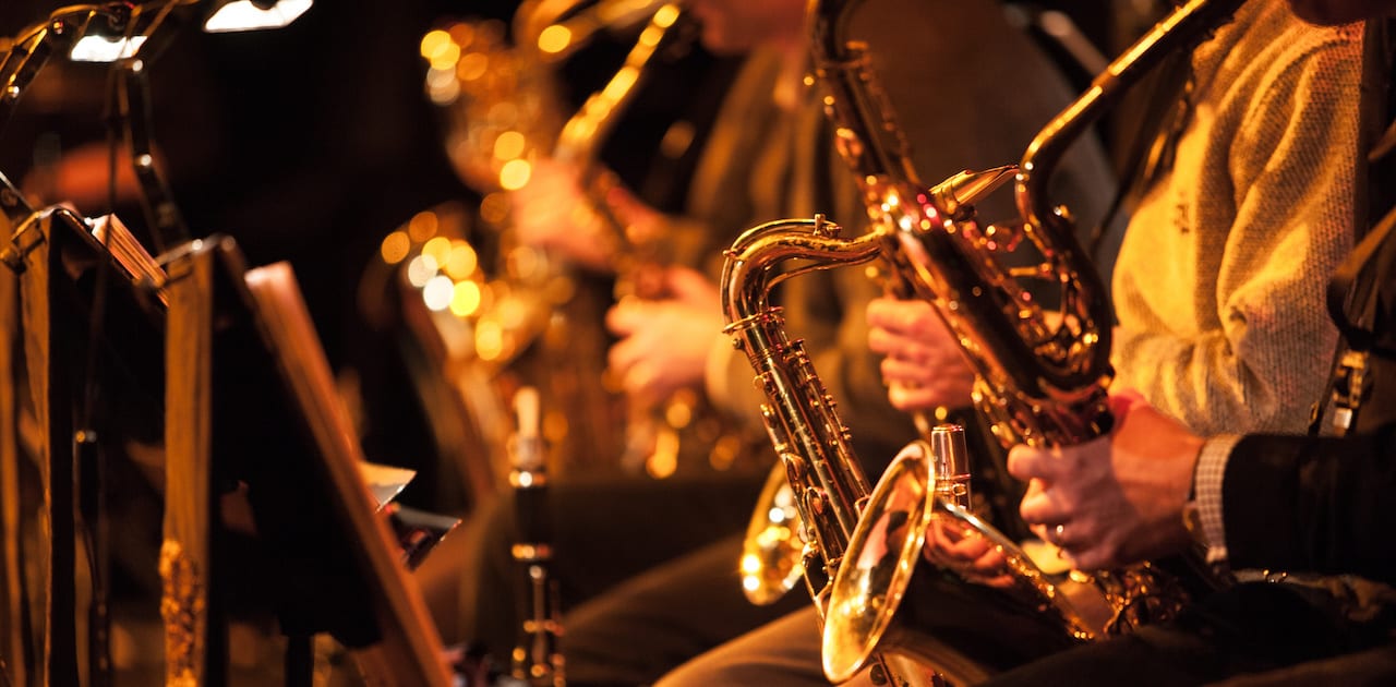 Big Band saxophone section. A candid view along the saxophone section of a big band in concert.