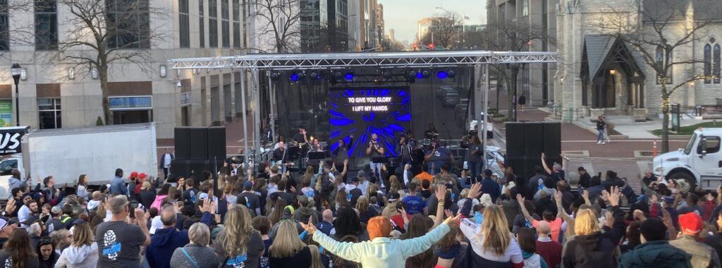 An outdoor worship service in Indianapolis, Indiana complete with a mobile stage.