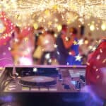 Dancing couples during party or wedding celebration with stars confetti